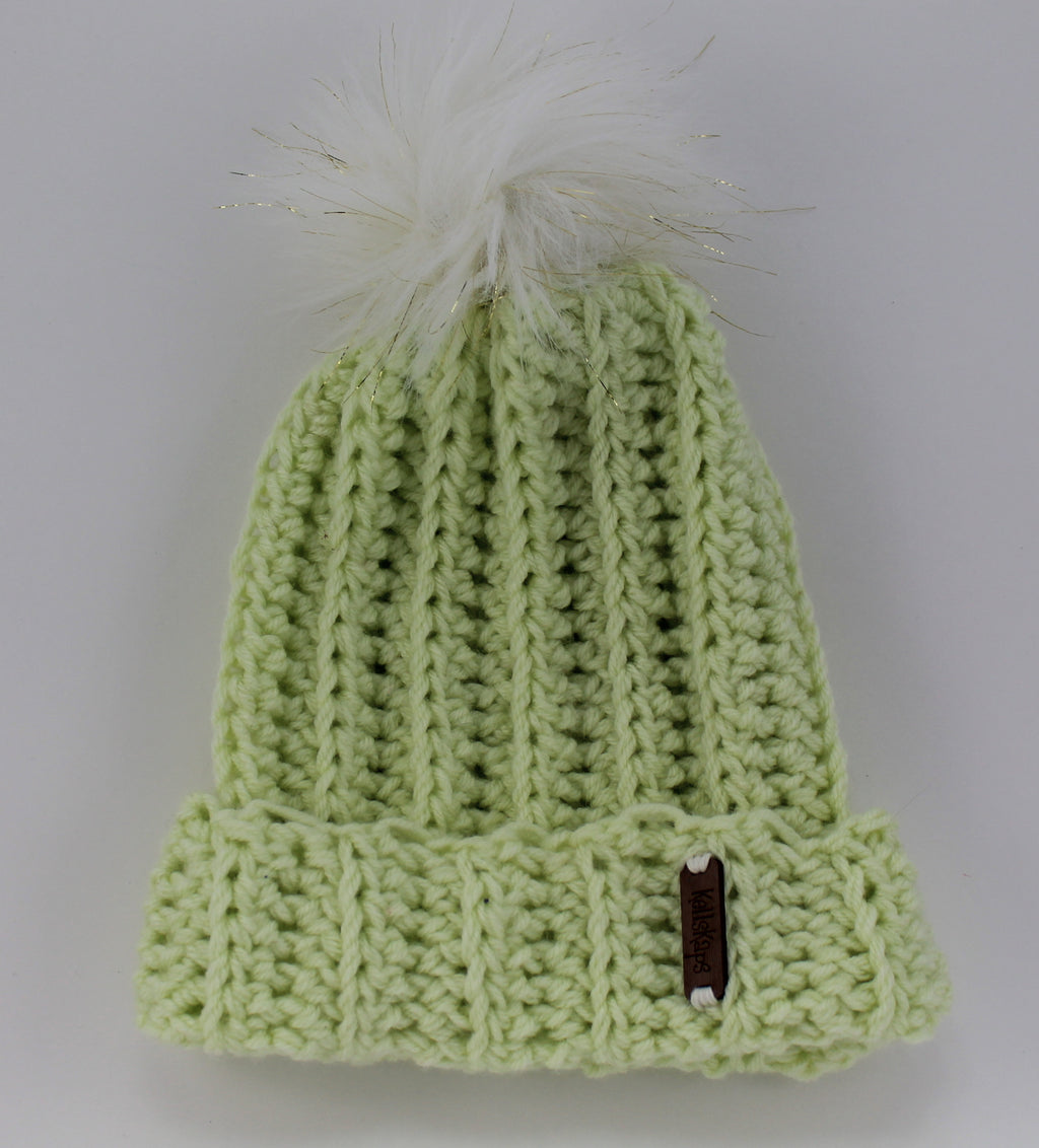 The Mimi Beanie in Pistachio with a White (with gold thread) Faux Fur Pom