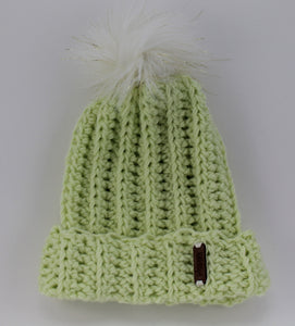 The Mimi Beanie in Pistachio with a White (with gold thread) Faux Fur Pom