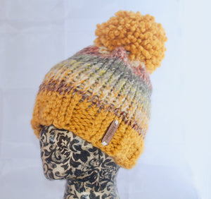 The Aura Beanie in Mustard and Coney Island.